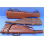 Three leg o' mutton leather gun cases (one for repair)