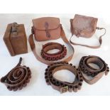 A small cartridge magazine, two cartridge bags (one all-leather) and four cartridge belts