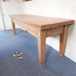 A early 20th century pine farmhouse style kitchen table on square tapering legs (220cm wide x 77cm