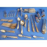 A large Community Plate cutlery service comprising various knives, forks, spoons and a meat