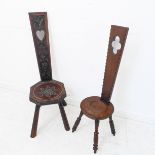 An early 20th century carved oak Welsh spinning stool, the vertical upright with a heart motif (