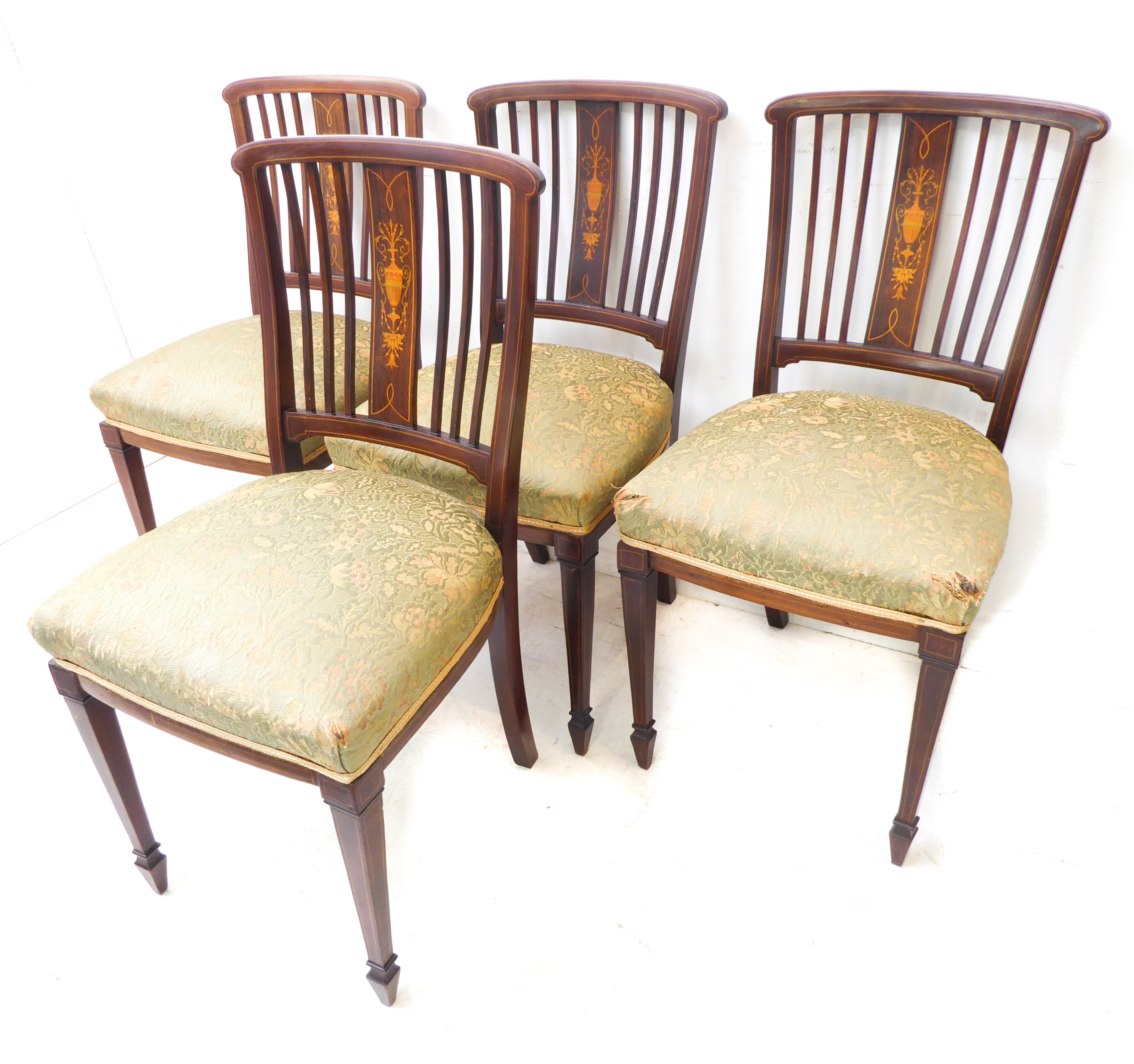 A good set of four Edwardian mahogany and boxwood strung salon chairs; each with central vertical