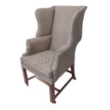 An early 20th century wing-backed library armchair in mid-18th century style and of small and