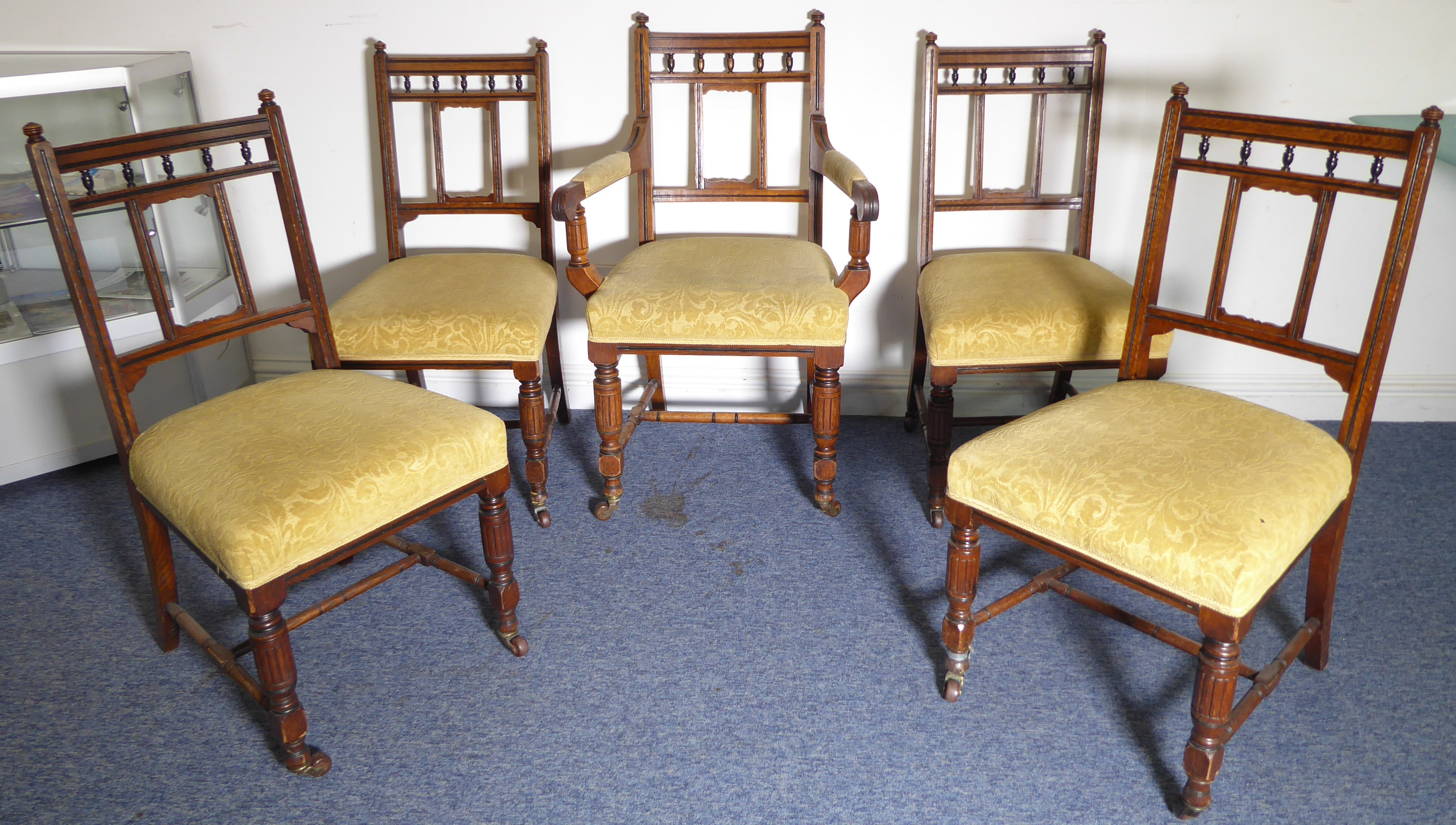 A set of five (4 + 1) late 19th century solid oak and ebonised dining chairs in the Aesthetic