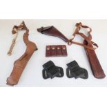 Three leather pistol holsters and three leather magazine holders: a Bianchi 'Phantom' shoulder