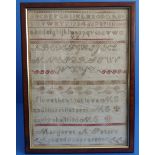 A 19th century framed and glazed (later) needlework sampler by Margaret A Peters aged 11 years