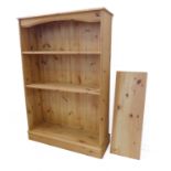 A modern open pine bookcase on plinth base (83cm wide x 28.5cm deep x 125.5cm high)