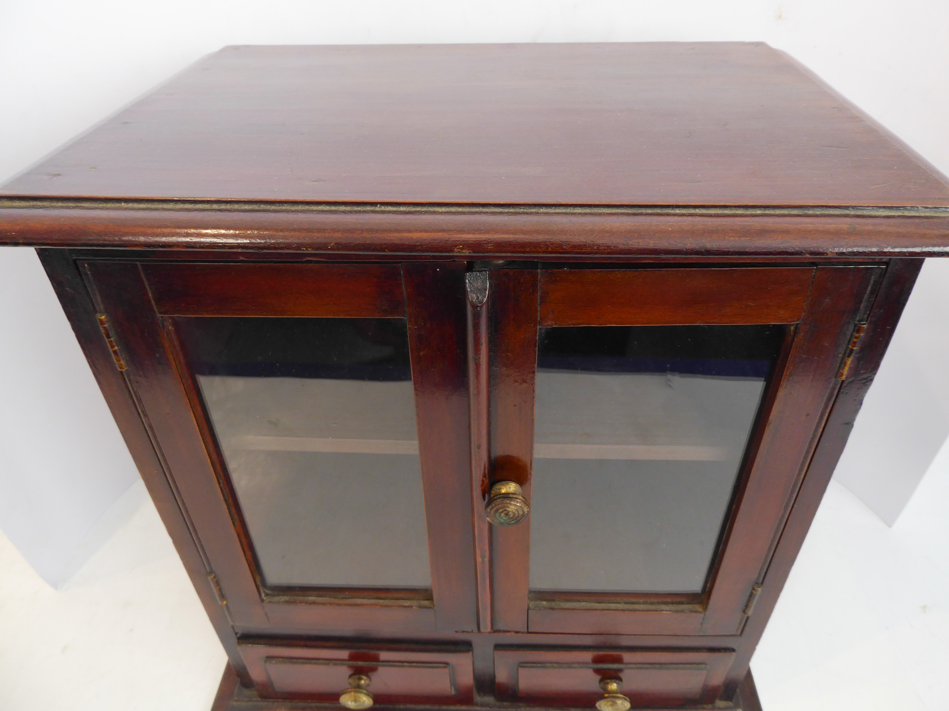 A late 19th/early 20th century mahogany table cabinet: the moulded top above two glazed doors - Image 3 of 7