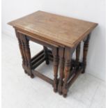 A nest of three early 20th century oak occasional tables: thumbnail moulded tops and turned legs (