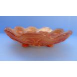 A large 1920s moulded amber glass flowerhead-shaped dish decorated with moulded flowers and