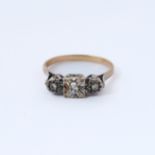 An antique three-stone diamond gold ring, ring size V