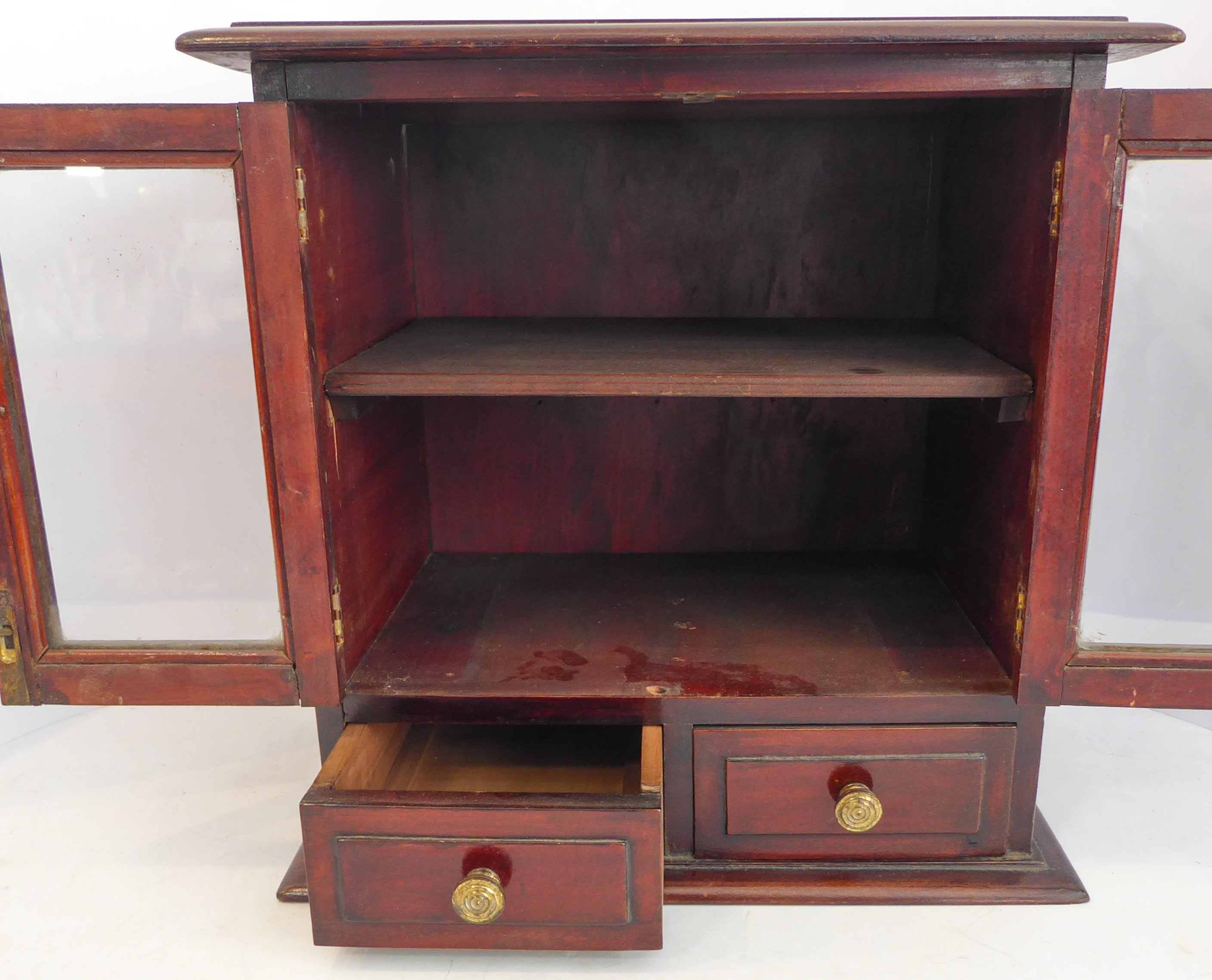 A late 19th/early 20th century mahogany table cabinet: the moulded top above two glazed doors - Image 7 of 7