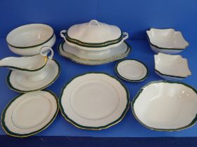 A Thomas Goode 'Emerald' 56-piece dinner service: 16 x 27 cm plates; 8 x 19.5 cm plates; 9 x 16 cm