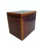 A George III period mahogany and rosewood crossbanded tea caddy of rectangular form: lined