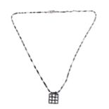 A silver pendant modelled as a portcullis upon a silver neck chain, in presentation box