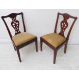 An unusual pair of late 19th / early 20th century miniature mahogany salon chairs in 18th century