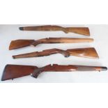 Four sporting rifle stocks, one good walnut small-bore example with cheek-piece comb, capped