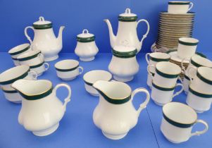 A Thomas Goode 'Emerald' 25-piece tea and coffee service: teapot and coffee pot; two milk jugs and