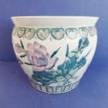 A large Chinese porcelain carp bowl/planter of ovoid form: the lip with key fret design above a band