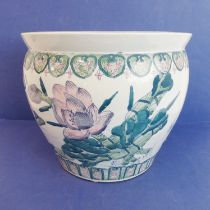 A large Chinese porcelain carp bowl/planter of ovoid form: the lip with key fret design above a band