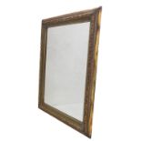 A modern gilt-framed looking glass: the frame with moulded laurel-leaf-style decoration and hand-