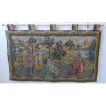 A wall-hanging cotton tapestry depicting a medieval style scene with buildings, castles, a lake,