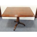 A 19th century rectangular mahogany tilt-top occasional table: tapering octagonal stem and tripod