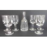 A set of six large and heavy wine goblets and a bell-shaped carafe commemorating the 1964