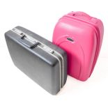 A black Samsonite suitcase (approx. 50cm wide x 38cm high) and a pink Opus wheeled suitcase (approx.