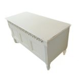 A white-painted chest with three-panel front and on turned front legs (95cm wide x 43cm deep x