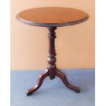 A mid-19th century circular mahogany tilt-top occasional table with turned, riven and fluted stem on