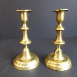 A pair of early/mid 18th century brass candlesticks with spun bases (17.5cm)