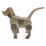 A novelty carved and painted dog in naïve style