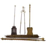 A 19th century brass and iron mounted set of three fireirons, together with two matching barleytwist