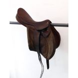 A 17.5" brown leather and suede saddle made by Pennwood of Wolverhampton (Mark Todd treeless?)