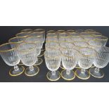 A set of 23 Murano wines with fluted bowls and gilded rims (11.5 cm) and 8 matching but slightly