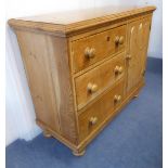 A late 19th century stained pine chest / side-unit: moulded top above a bank of three left-hand