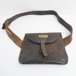 A  mid to late 19th century leather post-bag: the foldover flap with brass nameplate engraved '