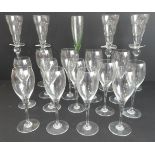 A set of four long-stemmed champagne glasses (36 cm high) with knop and hilt handles (two-cloud
