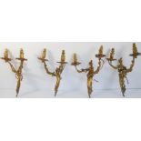 A set of four 19th century gilt metal wall appliques in Louis XV style (39cm high)