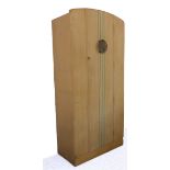 An Art Deco period bleached oak wardrobe: stylised iron handle with pierced leaf decoration and