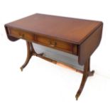 A reproduction mahogany Regency-style sofa table: two true drawers and two dummy drawers opposing,