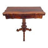 A mid-19th century foldover-top mahogany card table: flame mahogany veneered top above hexagonal