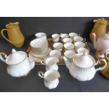 A Royal Albert 'Val D'or' tea service comprising: 2 teapots; 2 milk jugs and 2 sugars; 11 cups and