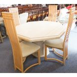 A heavy cream-marble octagonal dining table on conforming base (121 cm wide and 74 cm high).