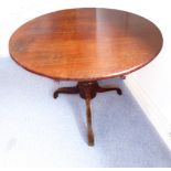 A 19th century stained-pine circular-topped breakfast table: bulbous stem and on three downswept