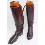 A good pair of circa 1960 gentleman's brown-leather riding boots with their calves later enlarged,
