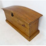 A dome-topped pine chest on plinth base (103cm wide x 46cm deep x 55cm high)
