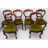 A harlequin set of eight mid-19th century mahogany balloon-back chairs: six with drop-in green