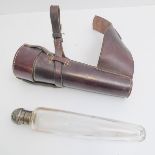 A vintage leather-cased glass hunting flask with silver-plated domed top